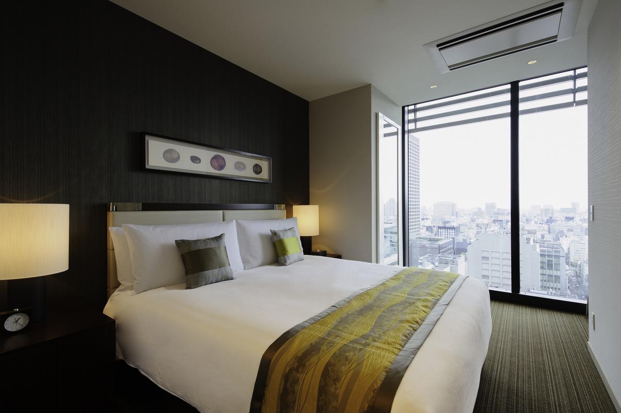 فندق أووكوود بريمير طوكيو المظهر الخارجي الصورة A bedroom at the hotel